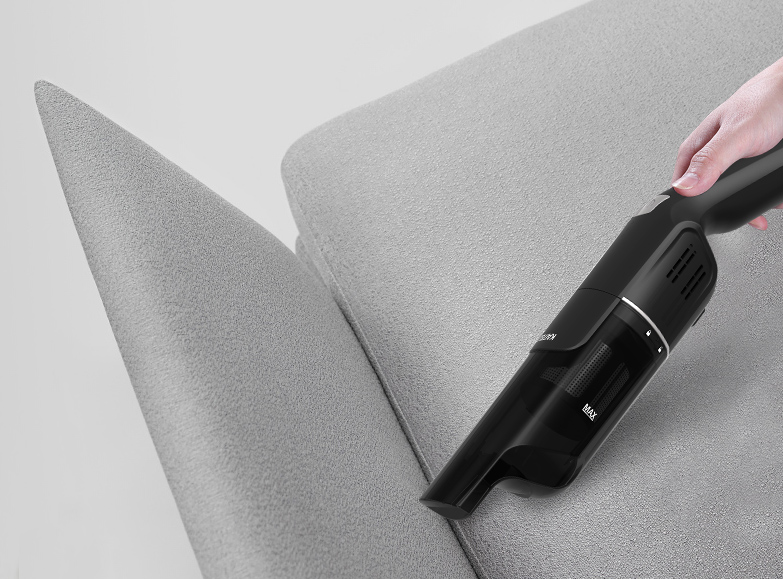 Handheld vacuum cleaning sofa upholstery